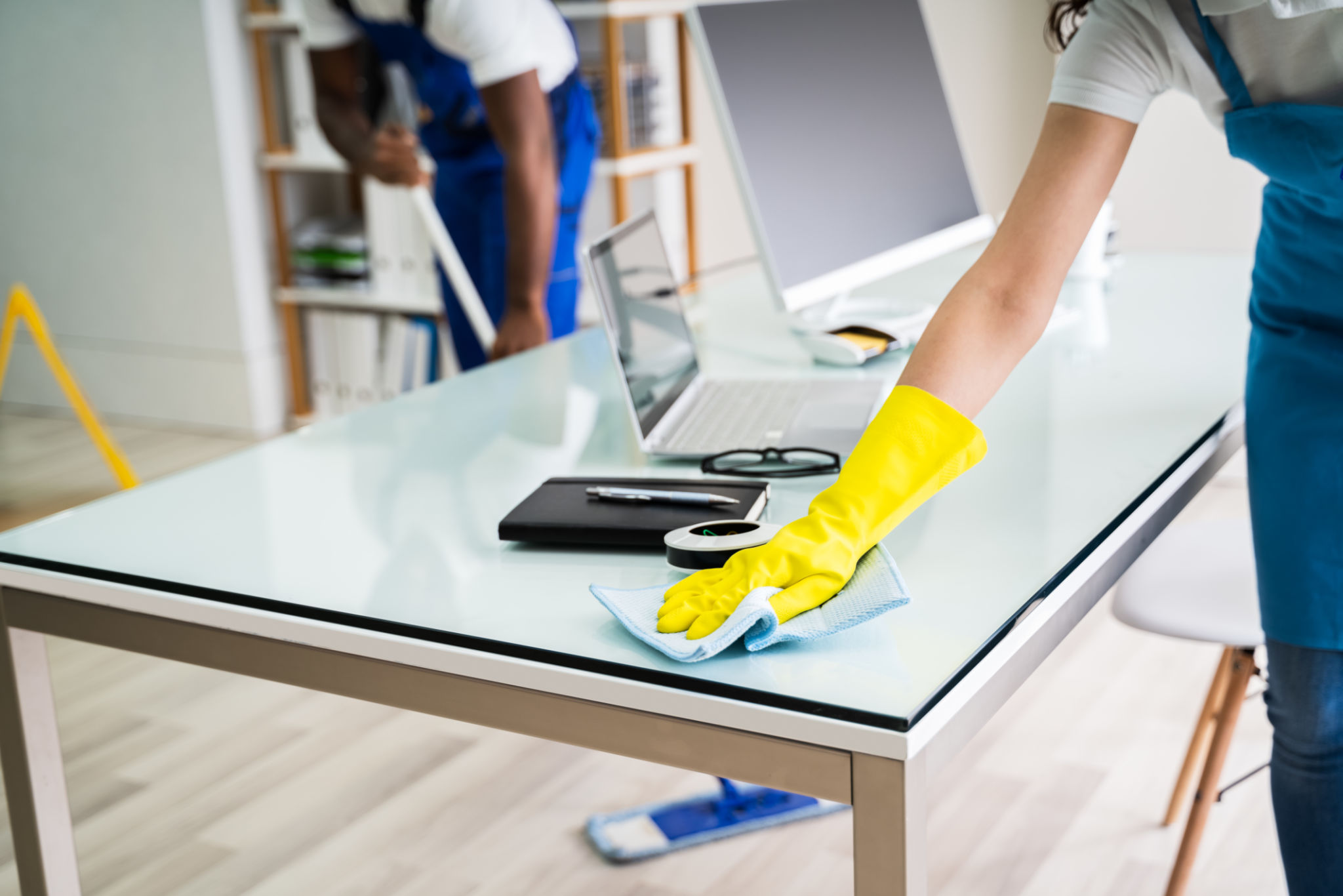 Male And Female Cleaners Cleaning Office Male And Female Cleaners Cleaning Office