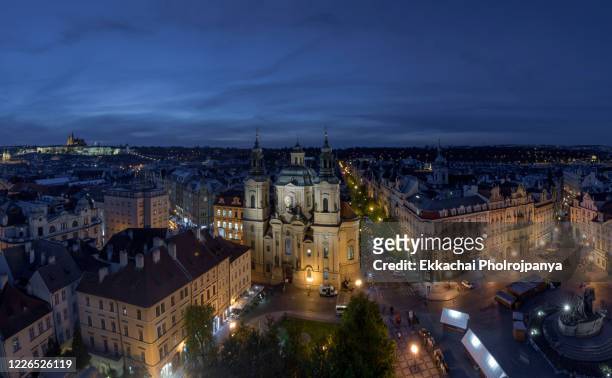 aerial view of old town square with st. nicholas' church in prague, czech republic  - april 24 ,2017 - cathedral of st vitus stock pictures, royalty-free photos & images