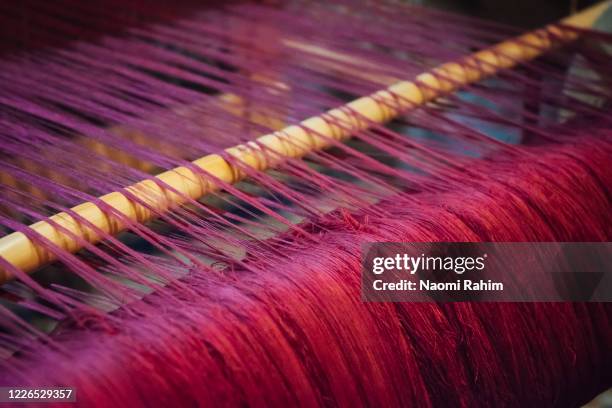 artisan weaving pink silk fabric in morocco - silk loom stock pictures, royalty-free photos & images