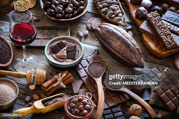 chocolate and red wine with cocoa powder melted chocolate - cacao bean stock pictures, royalty-free photos & images