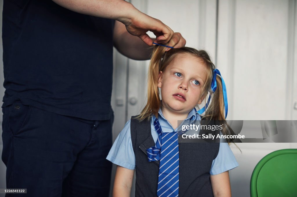 School child getting ready for school