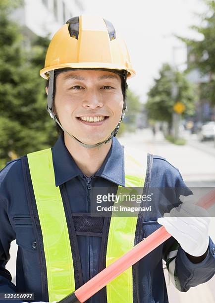 a smiling crossing guard - 交通誘導員 ストックフォトと画像