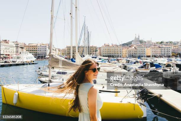 woman exploring marseille city during warm sunny summer day - hot women on boats stock pictures, royalty-free photos & images
