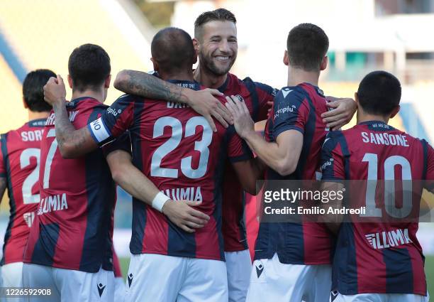 Danilo Larangeira of Bologna FC celebrates with his team-mates after scoring the opening goal during the Serie A match between Parma Calcio and...