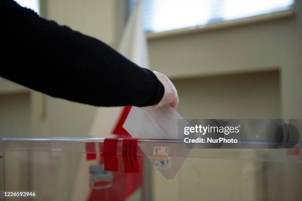 Voter casts his ballot during the second round of presidential elections on July 12, 2020 in Warsaw, Poland. Poles are voting in the presidential...