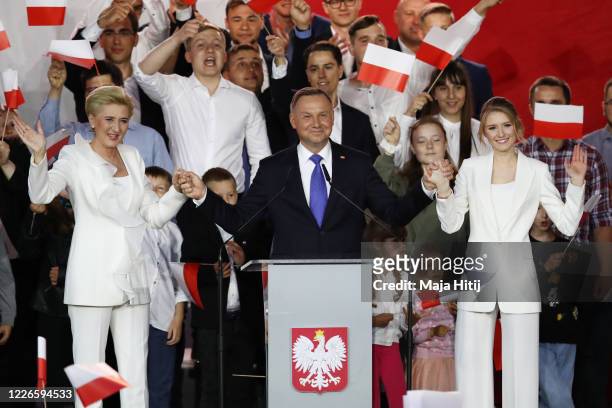 Polish President backed by the right-wing Law and Justice party , Andrzej Duda, his wife, Agata Kornhauser Duda and party members celebrate with...