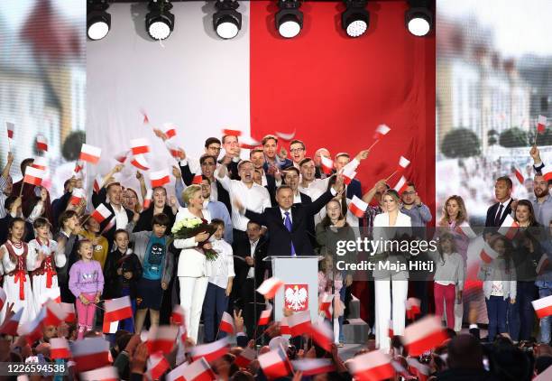 Polish President backed by the right-wing Law and Justice party , Andrzej Duda, his wife, Agata Kornhauser Duda and party members celebrate with...