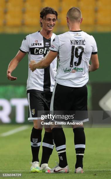 Roberto Inglese of Parma Calcio celebrates his goal with his team-mate Jasmin Kurtic during the Serie A match between Parma Calcio and Bologna FC at...