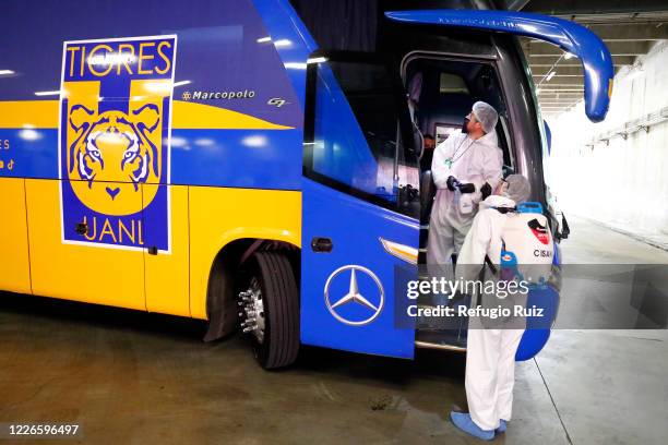 Staff members of the Akron Stadium sanitize a bus before the match between Atlas and Tigres UANL as part of the friendship tournament Copa GNP por...