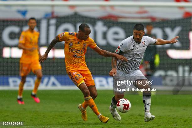 Lorenzo Reyes Atlas fights for the ball with Luis Quiñones of Tigres during the match between Atlas and Tigres UANL as part of the friendship...