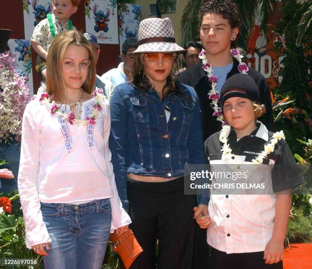 Lisa Marie Presley and her children Benjamin Keough , Riley Keough , and her half-brother Navarone Garibaldi attend the premiere of "Lilo and Stitch"...