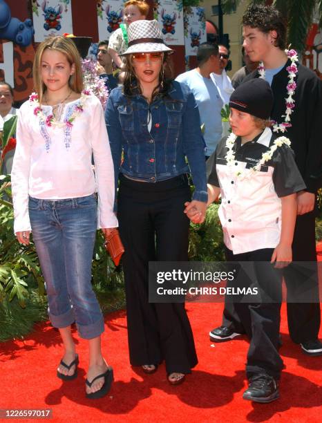 Lisa Marie Presley and her children Benjamin Keough , Riley Keough , and her half-brother Navarone Garibaldi attend the premiere of "Lilo and Stitch"...