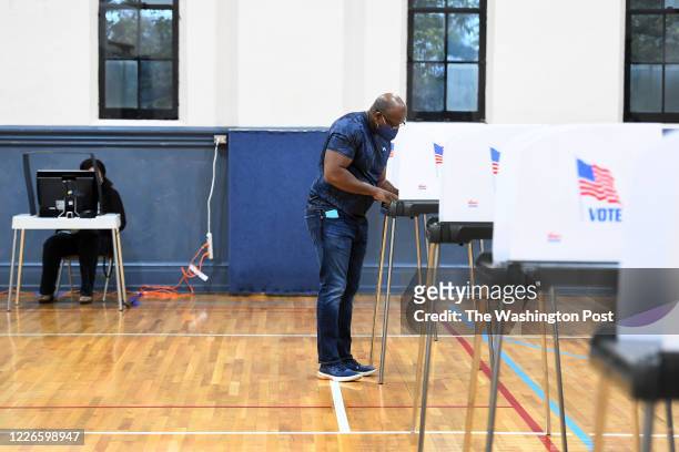 Eric Adams uses a paper ballot to cast his votes during the primary election at the William R. Talley Recreation Center June 02, 2020 in Frederick,...