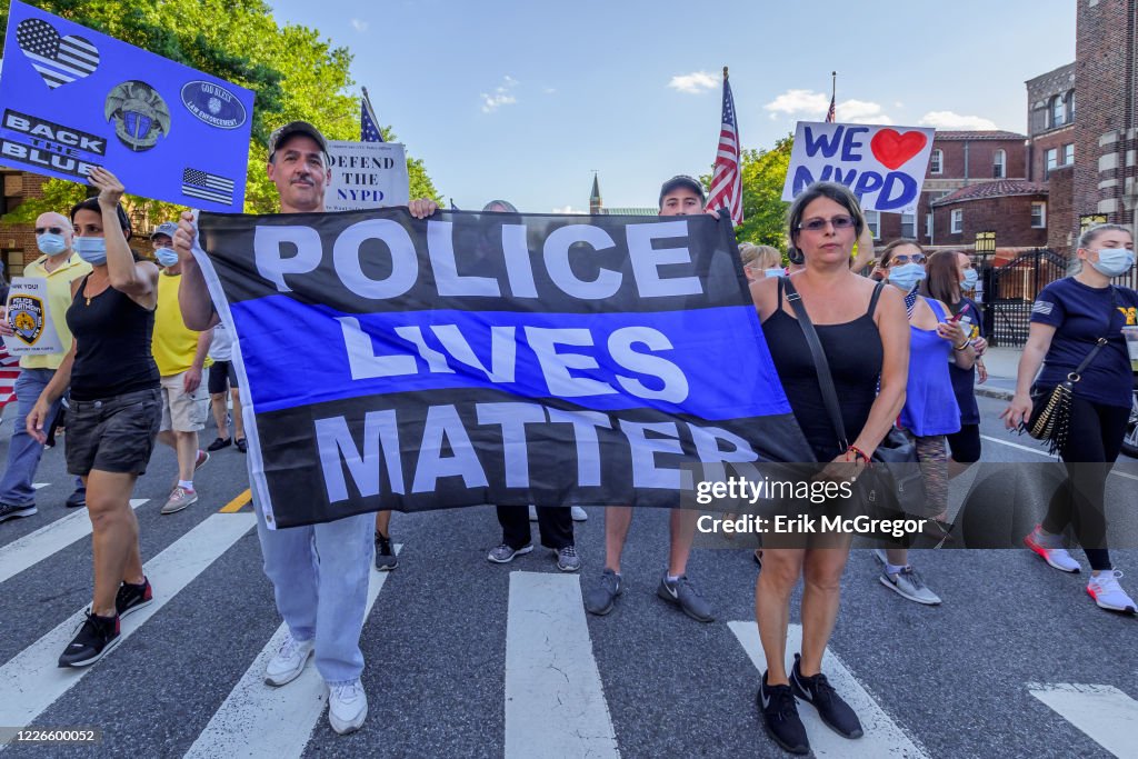 Pro-cop protesters carryng a Blue Lives Matter flag at the...