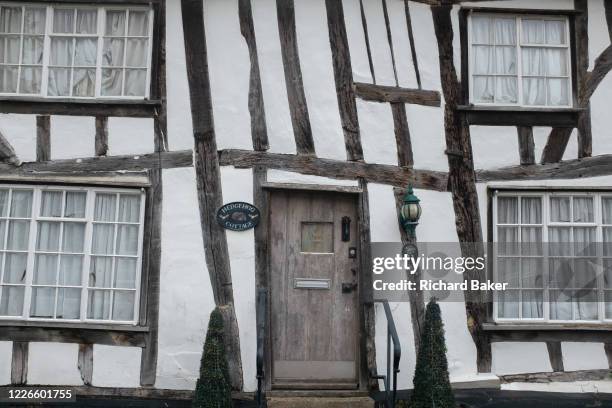 Medieval architecture of houses along the High Street of wool town, Lavenham, on 9th July 2020, in Lavenham, Suffolk, England. By the late 15th...