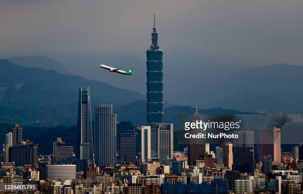 Domestic flight connecting Taipei City to Nangan Township departs from Songshan Airport and passes through in front of the Taipei 101 building, amid...