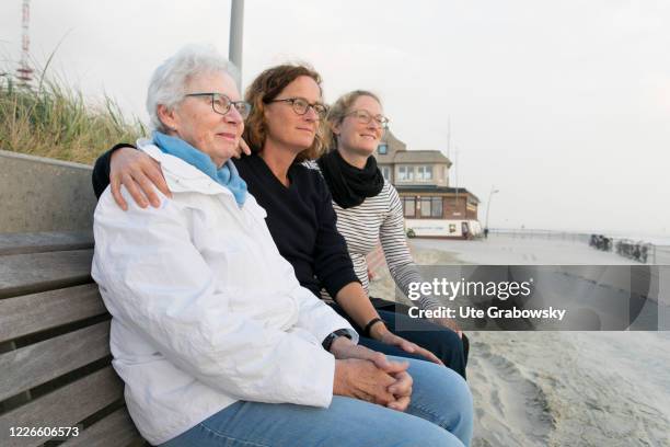 Three generations on a park bench on the beach of Borkum on October 06, 2018 in Borkum, Germany.