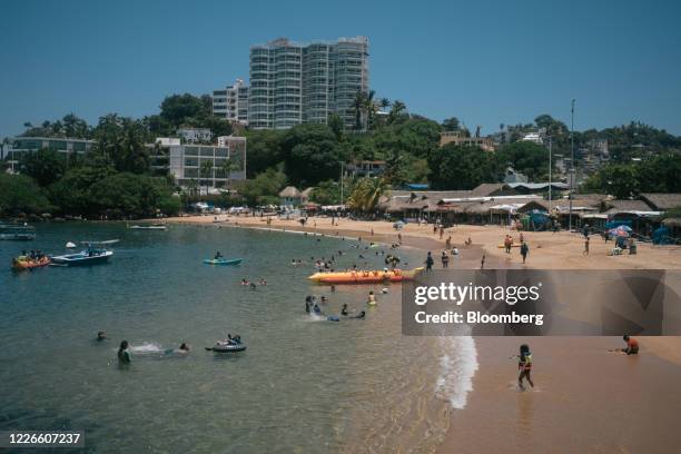 People visit a beach in Acapulco, Guerrero state, Mexico, on Friday, July 10, 2020. Mexico surpassed Italy in the number of Covid-19 deaths, and has...