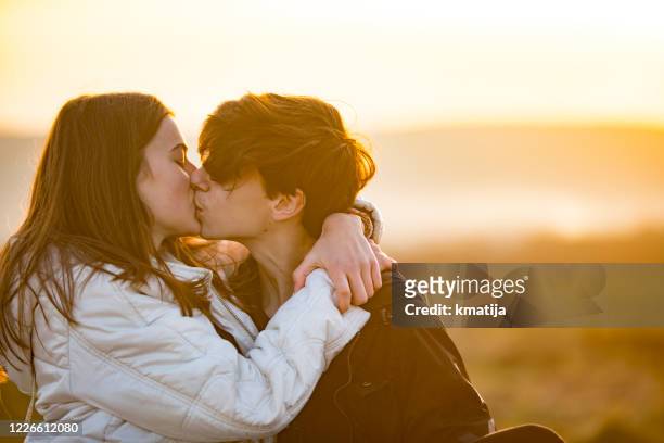 Boy Girl Kissing Photos and Premium High Res Pictures - Getty Images