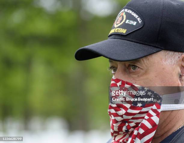Volunteers arrive to place flags at the Calverton National Cemetery on May 23, 2020 in Wading River, New York. The U.S. Department of Veterans...