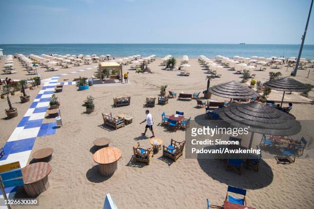 View of a reopened beach in Lido on May 23, 2020 in Venice, Italy. Restaurants, bars, cafes, hairdressers and other shops have reopened, subject to...