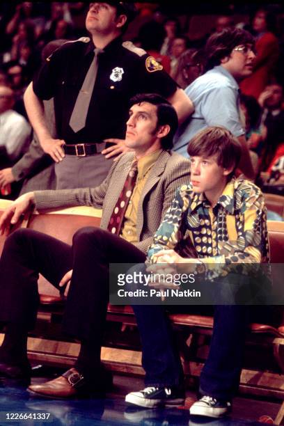 American basketball player Jerry Sloan , of the Chicago Bulls, sits courtside during a game at Chicago Stadium, Chicago, Illinois, during the...