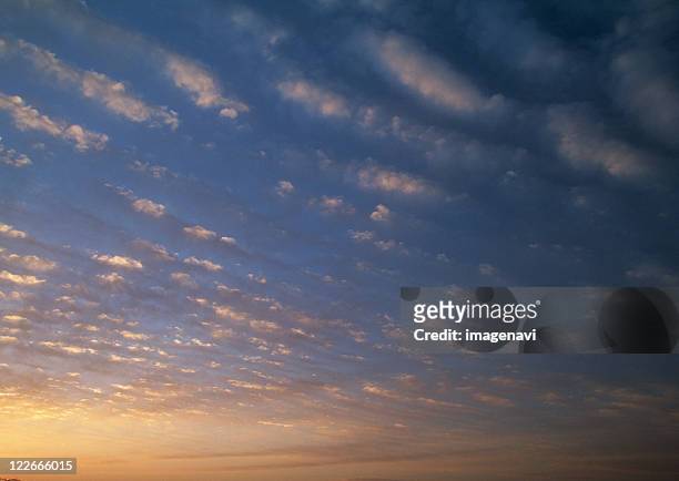 altocumulus clouds in sky - cirrocúmulo fotografías e imágenes de stock