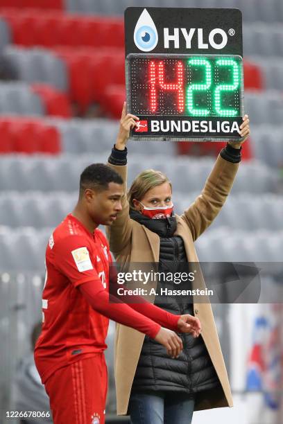 Kathleen Krüger, team managerin FC Bayern Muenchen holds the substitution board during the Bundesliga match between FC Bayern Muenchen and Eintracht...