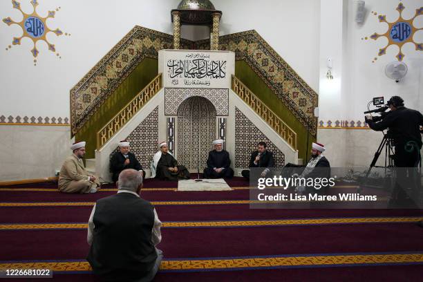 Man looks on as Sheikh Ahmed Tebbie, Sheikh Fawaz Kamaz, Sheikh Mohamed Harby, Imam and Reciter of Lakemba Mosque, Sheikh Yahya Safi, Imam of Lakemba...