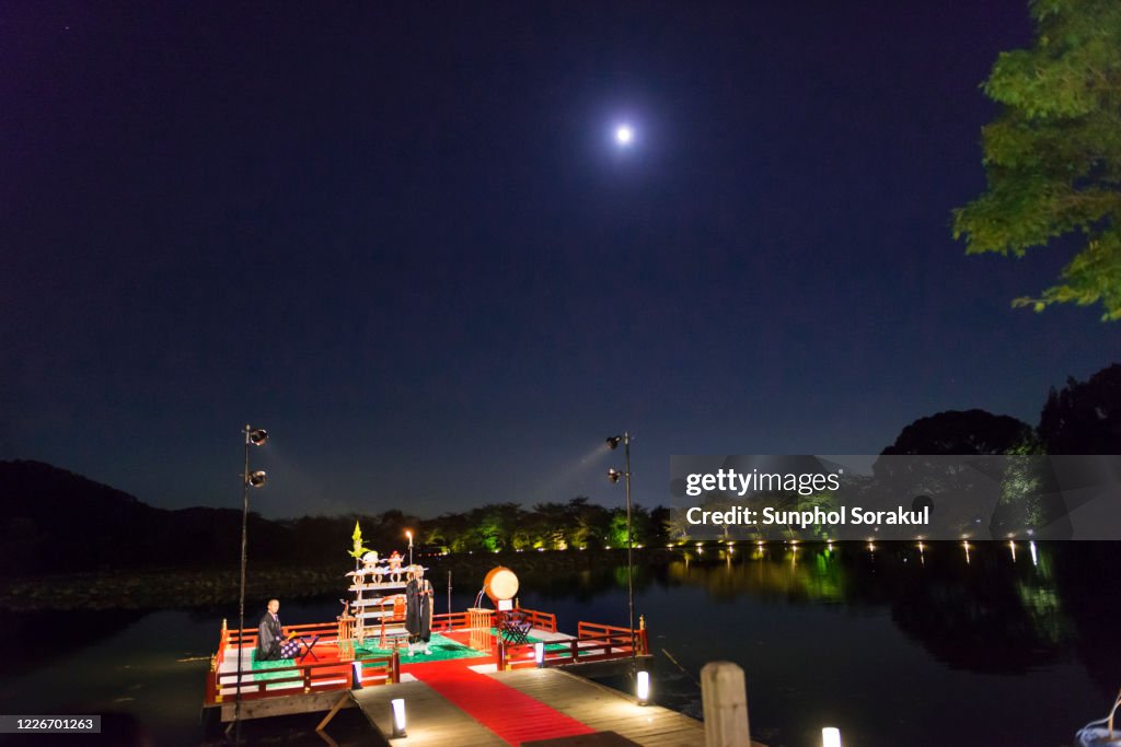 Monks chanting on the stage over Osawa pond during Tsukimi festival