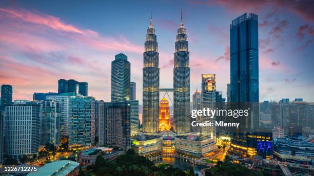 petronas twin towers sunset twilight panorama kuala lumpur malaysia - petronas towers stock pictures, royalty-free photos & images
