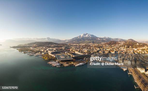 aerial panorama of lucerne old town and waterfront with mt pilatus by lake lucerne in switzerland - chapel bridge stock pictures, royalty-free photos & images