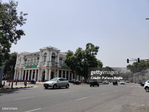 In the heart of New Delhi, the famous Connaught Place market still almost deserted just a few shoppers and boys playing cricket in the corridors....