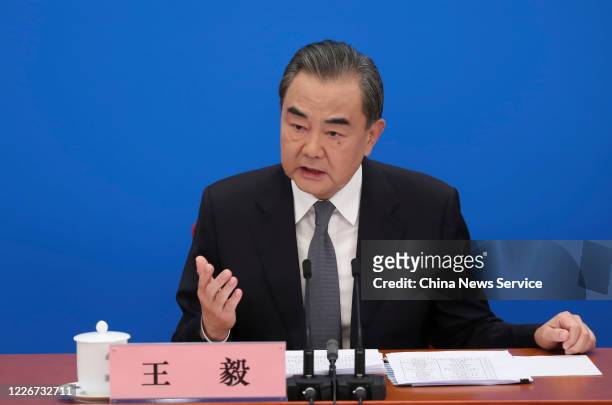 Chinese State Councilor and Foreign Minister Wang Yi attends a press conference of the third session of the 13th National People's Congress at the...