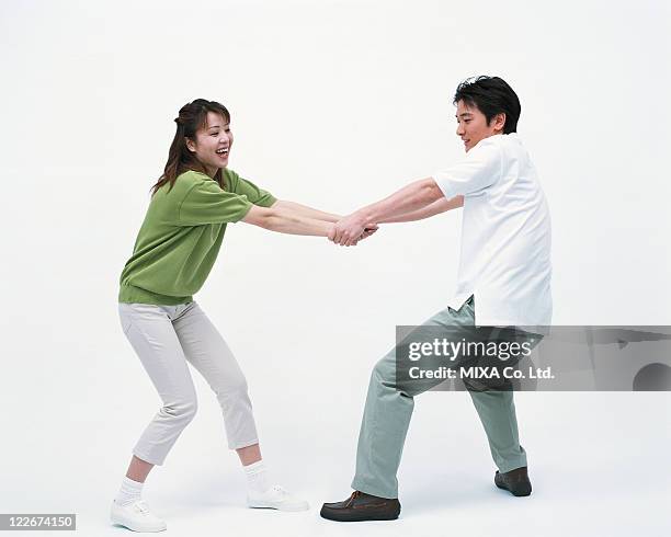 Hand Pull In Hands Pulling White Background Photos and Premium High Res Pictures ...