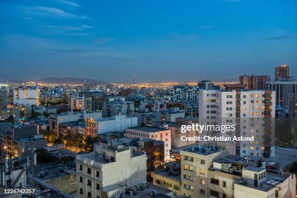 sunset and view of the populated elahieh, an affluent and upper-class district in northern tehran. the area is a residential and commercial locale and is filled with the homes and businesses of many politicians, diplomats, expatriates, and artists - tehran night stock pictures, royalty-free photos & images