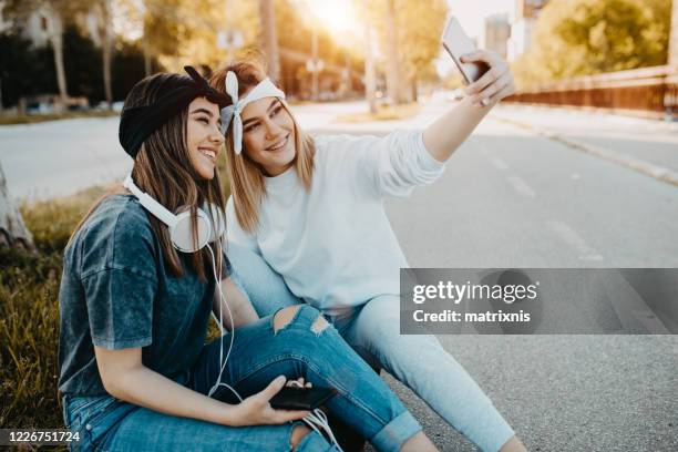 hey sister let us make one selfie - hey pretty girl stock pictures, royalty-free photos & images