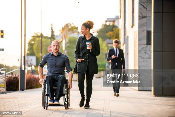 diverse young business partners talking during outdoor break - man talking to camera stock pictures, royalty-free photos & images