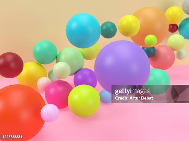 creative digital picture of colorful balls levitating in studio set. - party background stock-fotos und bilder