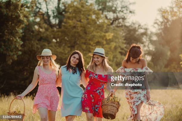 girls spending day in nature - four people walking stock pictures, royalty-free photos & images