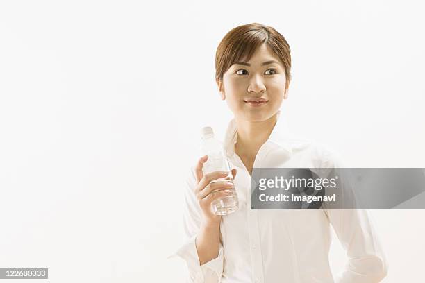 woman holding water bottle - kind face stock pictures, royalty-free photos & images