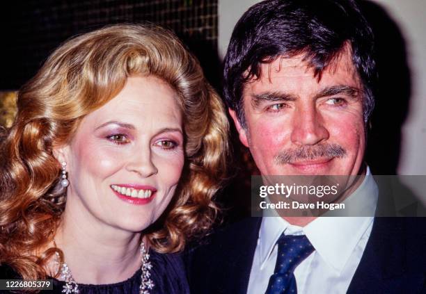 Faye Dunaway and Alan Bates in London on April 21st 1983.