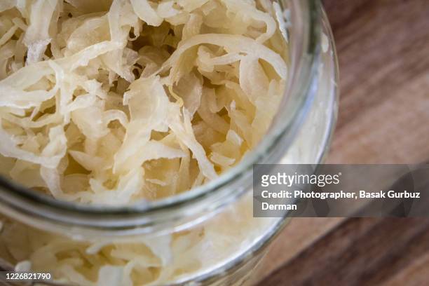 a jar of sauerkraut - choucroute stock-fotos und bilder