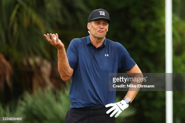 Player Tom Brady of the Tampa Bay Buccaneers reacts on the seventh green during The Match: Champions For Charity at Medalist Golf Club on May 24,...