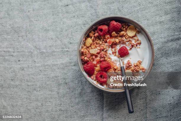 bowl with cereal and fruit for breakfast - cornflakes stock pictures, royalty-free photos & images