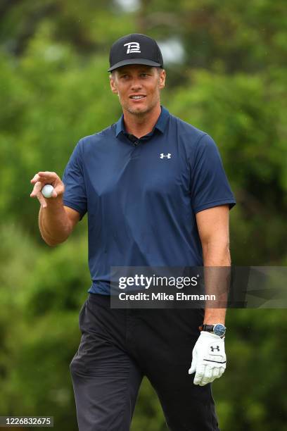 Player Tom Brady of the Tampa Bay Buccaneers reacts during The Match: Champions For Charity at Medalist Golf Club on May 24, 2020 in Hobe Sound,...