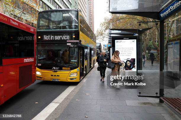 General view is seen of passengers at the Wynyard park bus stop on May 25, 2020 in Sydney, Australia. Additional security and marshalling staff will...