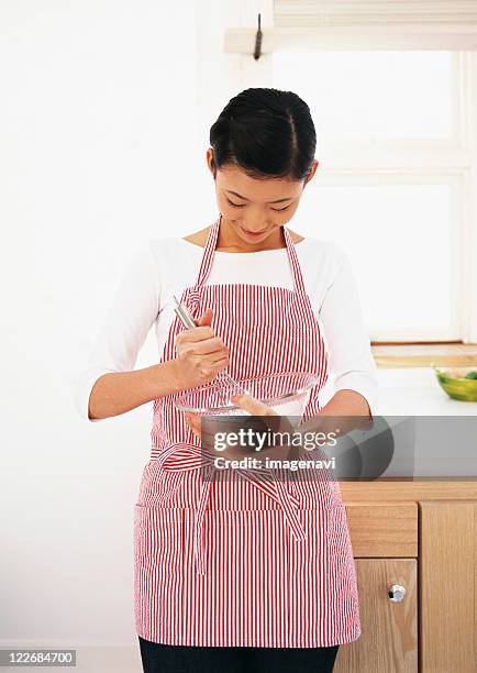 kitchen scene - woman smiling facing down stock pictures, royalty-free photos & images