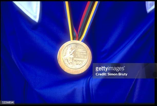 A CLOSE-UP OF A GOLD MEDAL TAKEN AT THE 1992 BARCELONA OLYMPICS.