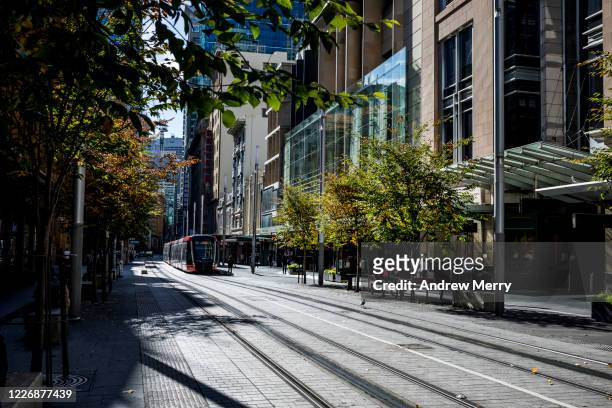 city street with tram tracks and shops, sydney, australia - street sydney stock pictures, royalty-free photos & images